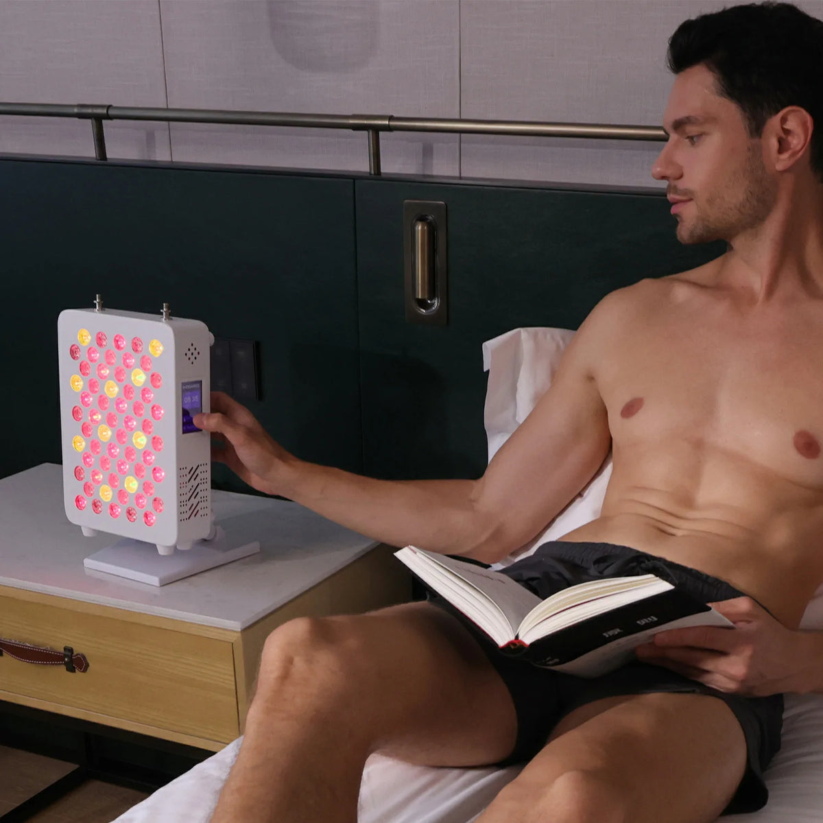 Person using the RL60S desktop red light therapy panel