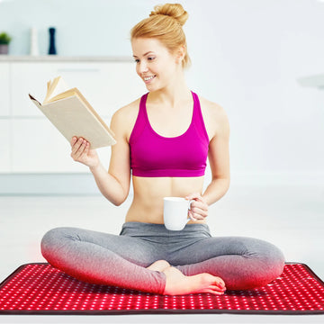 Person using the TLB600 red light therapy pad