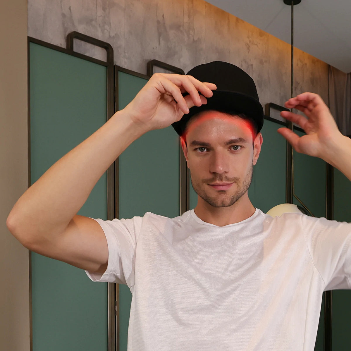 Person using the TLH150WP-A red light therapy cap